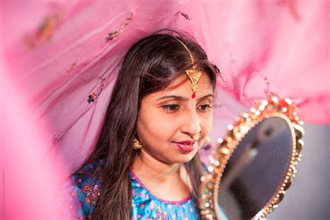 Young Indian Woman With Traditional Dress And Jewelry And Looking At