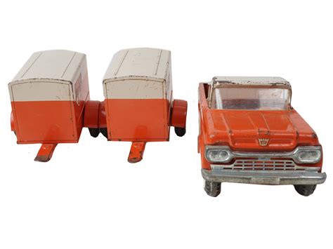 Lot 545 | VINTAGE NY LINT UHAUL FORD TRAILER TRUCK TIN TOY