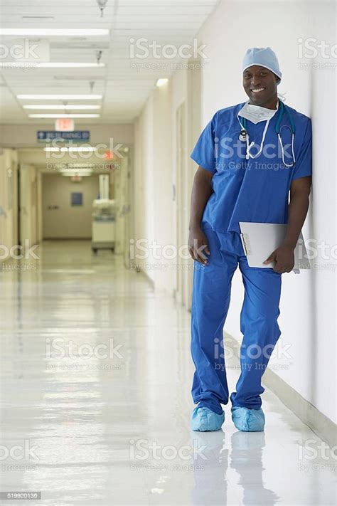 Nurse Standing In A Hospital Corridor Stock Photo Download Image Now