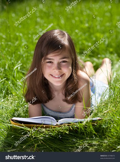 Girl Lying On Green Meadow Reading Stock Photo Edit Now 33798073