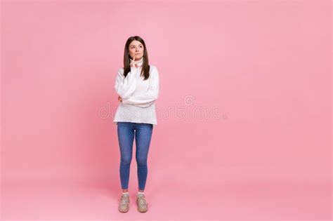Full Length Portrait Of Thoughtful Female Standing Thinking About Important Things Looking Away