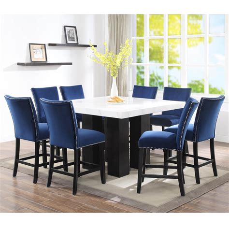Fits narrow spaces with a reasonable size. Steve Silver Camila 9 Piece Counter Height Dining Set with ...