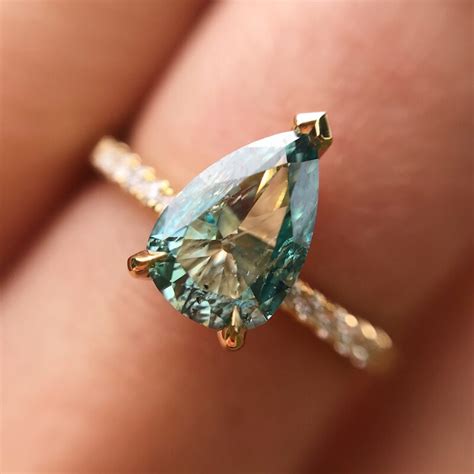18ct Yellow Gold And Pear Shaped Blue Diamond Ring With Tapered Band