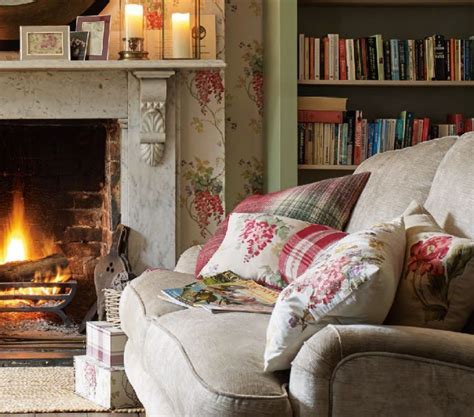 Keeping Warm By The Open Fire In A Cottage Living Room Cottage