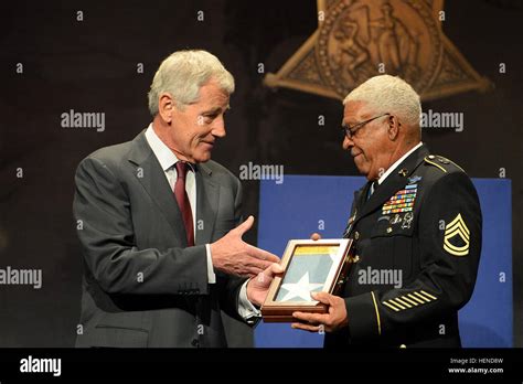 Staff Sgt. Melvin Morris is presented the Medal of Honor Flag by