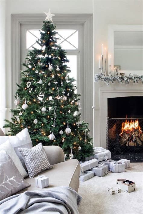 Tall curtains add drama and lead the eye up to the natural wood beams. 32 Best Christmas Living Room Decor Ideas and Designs for 2020