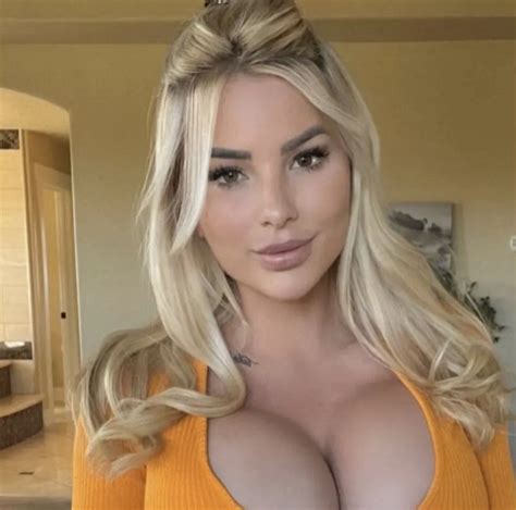 Blonde In Orange Sweater Huge Tits Gothanalgape