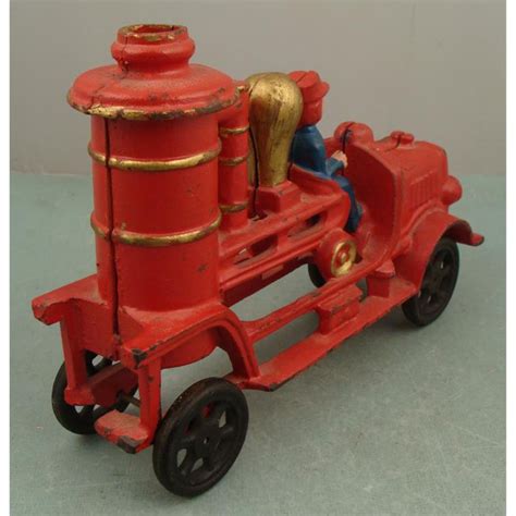 Check spelling or type a new query. Cast Iron Toy Fire Engine Firetruck Antique Repro