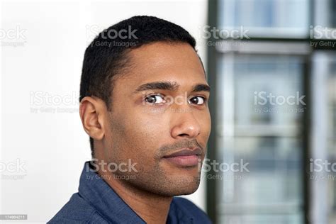 Young Black Man Looking At Camera Indoors Portrait Stock Photo