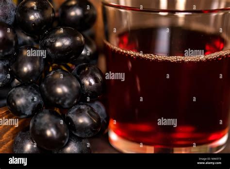 Red Grape Juice In Glass And Grapes Close Stock Photo Alamy