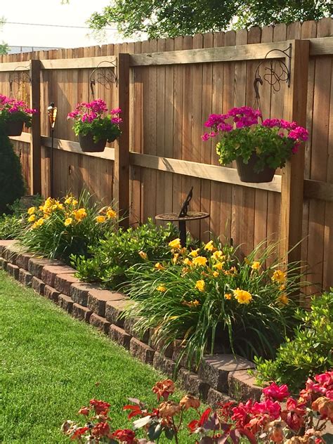 So instead of saturating it with furniture and an eyesore of a fence, get creative with landscaping. Bring the flowers high with hanging baskets | Backyard ...