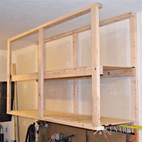 Once assembled, slide your storage bins in the flange. How To Create Garage Storage With Ceiling Mounted Shelves ...