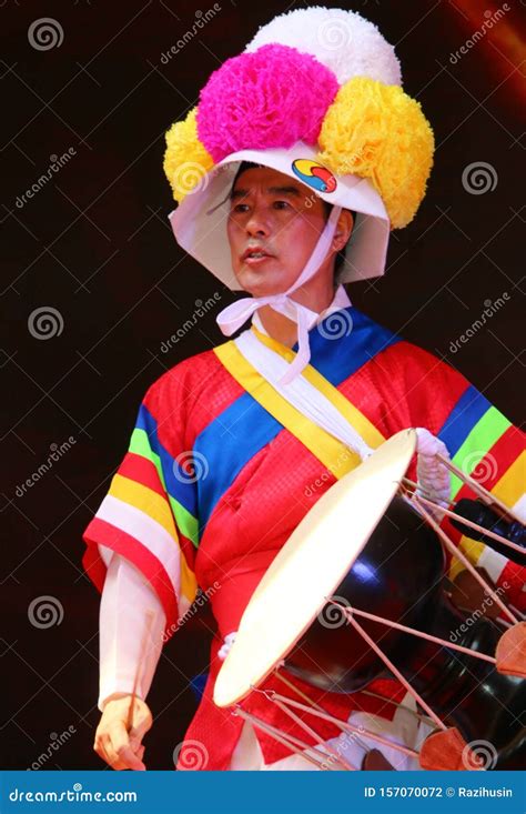 Korean Drummer Playing The Traditional Hourglass Shaped Drum Also Known As Janggu Editorial