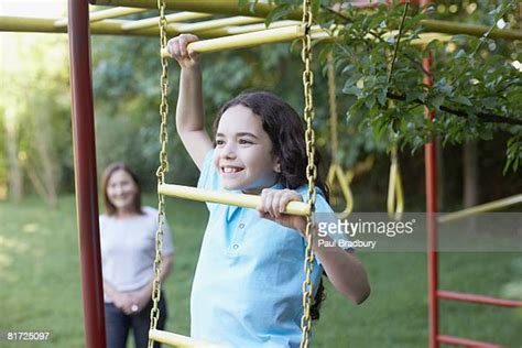 girl climbing ladder fotografías e imágenes de stock getty images
