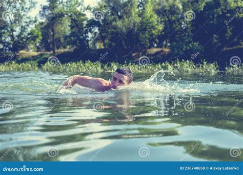 The Young Man Swimming In The River Stock Photo Image Of Male