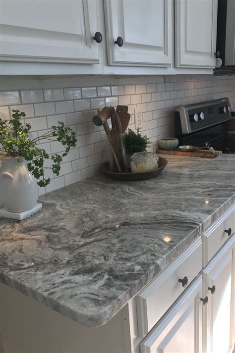 Fantasy Brown Granite With Small White Subway Tiles And Warm Gray Grout