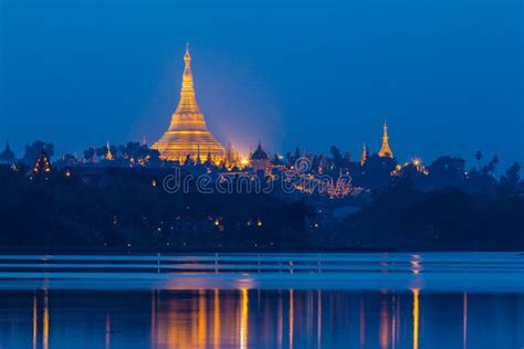 Sunset In The Front Of The Lake View Of Shwedagon Pagoda Yangon