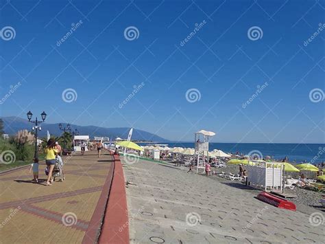 People Walk Along Seaside Promenade And Relax At The Beach Resort Sochi