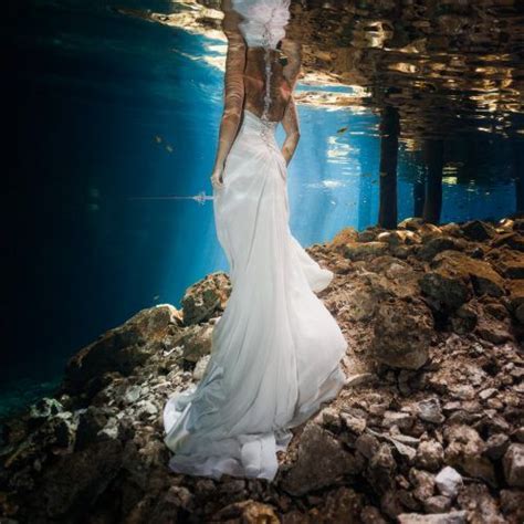 A Woman In A White Dress Under Water