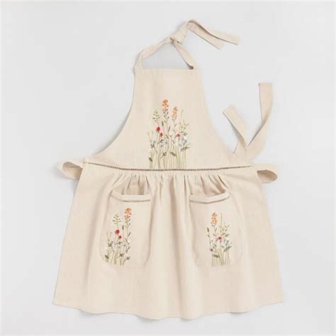 Practical Meets Chic In Our Natural Cotton Apron Featuring Delicately