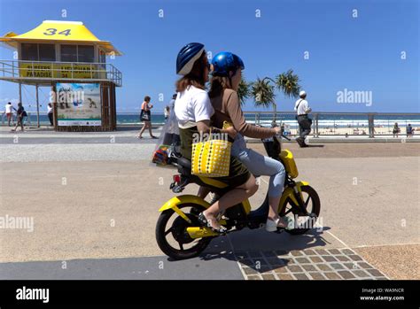 Moped Riders On The Esplanade Surfers Paradise Queensland Australia