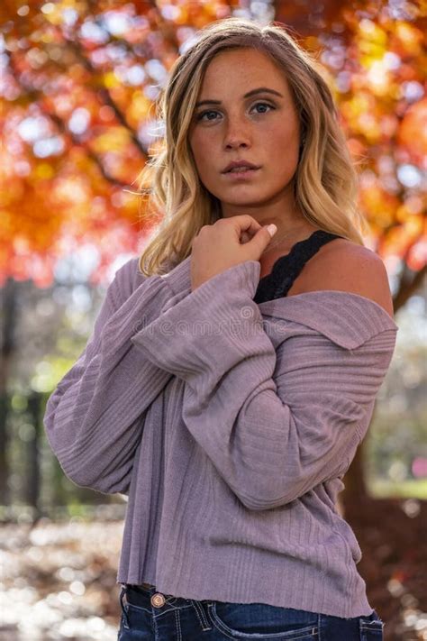 A Lovely Blonde Model Enjoys An Autumn Day Outdoors At The Park Stock Image Image Of Beautiful