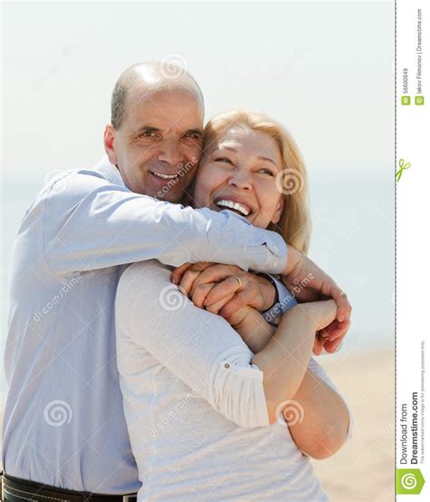 Man And Woman Resting On The Sea Shore Stock Image Image Of Sand
