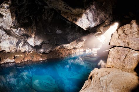 Sun Shining Into A Natural Hot Spring Cave In Northern Iceland Stock