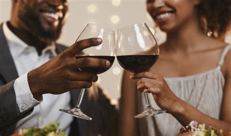 Close Up Of African Couple Toasting With Red Wine Easy Prey Podcast