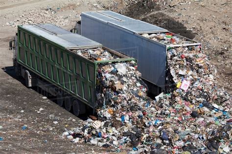 Trucks Dumping Waste In Landfill Stock Photo Dissolve