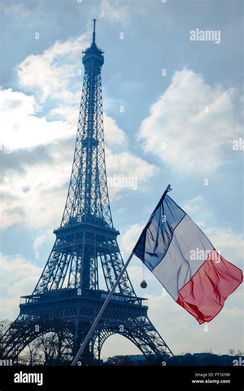 French Tricolor Flag In Front Of Eiffel Tower In Paris France Stock