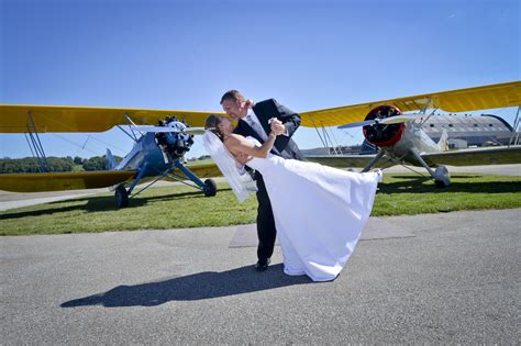 romantic wedding amidst vintage airplanes