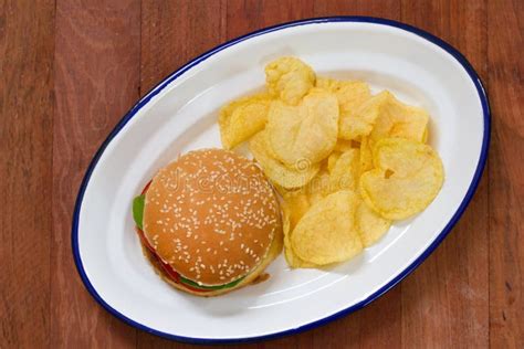 Hamburger With Potato Chips On White Dish Stock Photo Image Of Meal