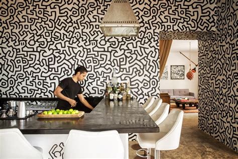 In The Lounge Area A Funky White And Black Wallpaper Design Imbue The Space With Vibrance And