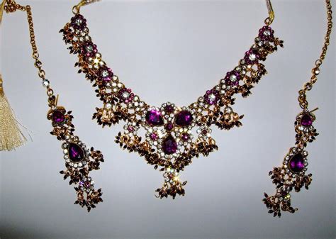 Maybe you would like to learn more about one of these? Purple & Gold Indian Jewellery Set