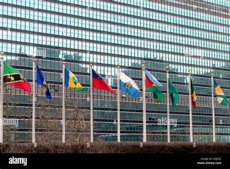 United Nations Building With Flags Flying Outside In New York Stock
