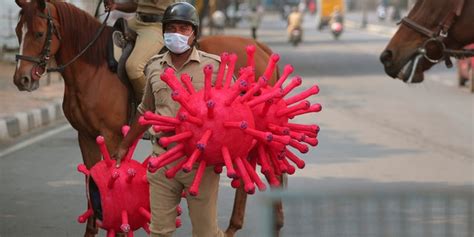 Police In India Raise Coronavirus Awareness With Virus Costumes While