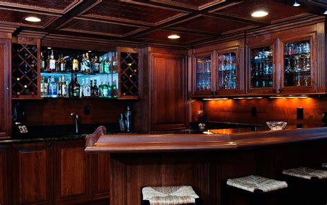A basement wet bar can be especially useful in a house that sits on a slope with a walkout basement and patio. Basement Bars - Custom Wood Creations