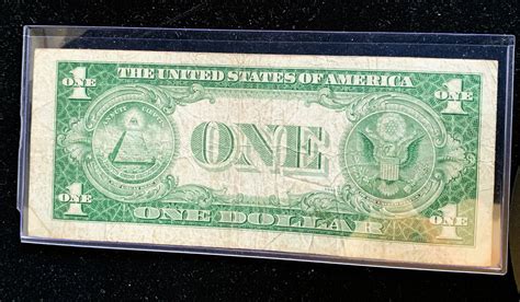 SILVER CERTIFICATE SERIES 1935 E ONE DOLLAR NOTE, BLUE LABEL, NICE IN