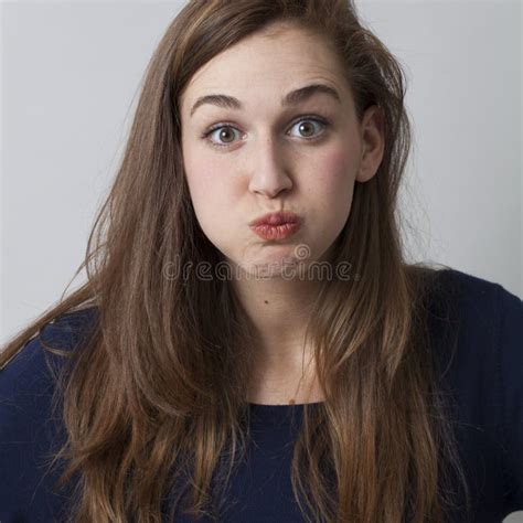 Surprised Beautiful 20s Girl Puffing Her Cheeks Out Stock Photo Image