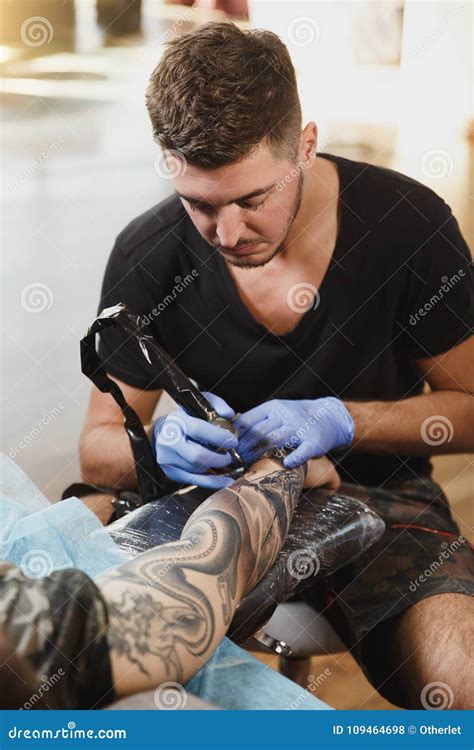 Male Professional Does Tattooing In The Cabin Stock Photo Image Of