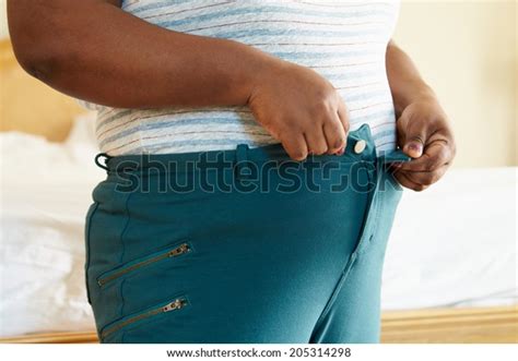 Close Overweight Woman Trying Fasten Trousers Stock Photo 205314298