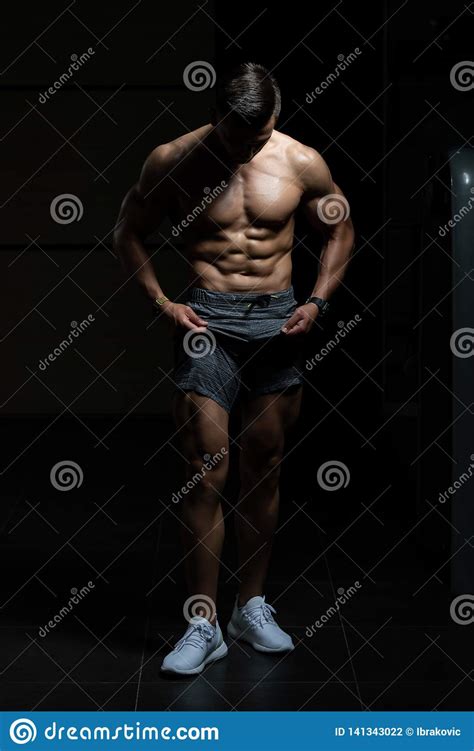 Young Bodybuilder Flexing Muscles Stock Photo Image Of Beauty