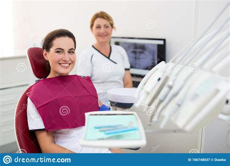 Young Smiling Woman Patient At Dental Clinic Stock Image Image Of