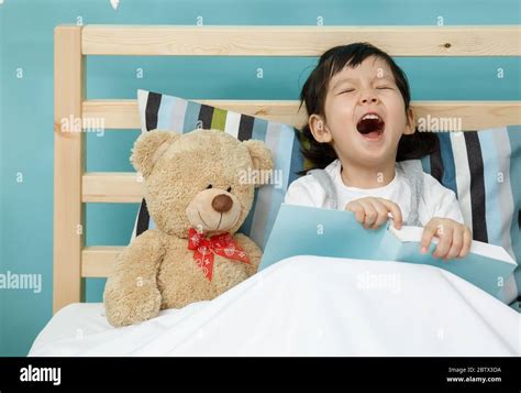 Little Girl Baby On The Bed In The Room Hi Res Stock Photography And