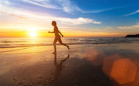 girl runs along the beach at sunset background fitness stock image image of running runner
