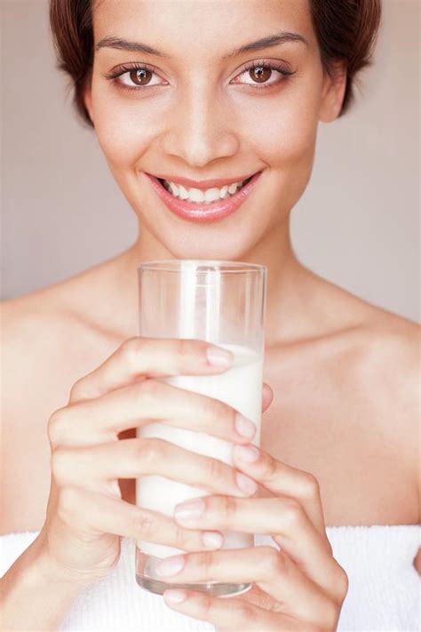 Woman Drinking Milk Photograph By Ian Hooton Science Photo Library