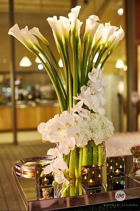 tall centerpiece calla lily wrapped in white orchids and hydrangea event planning and des