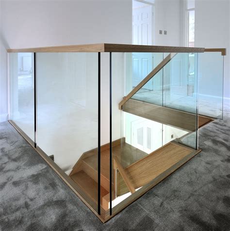Landing Shot Of The Contemporary Oak And Glass Staircase We Created