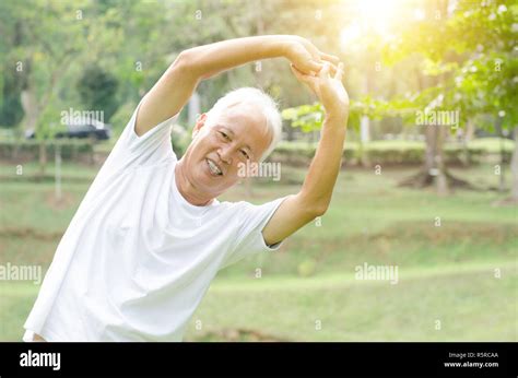 Old Man Stretching Outdoor Stock Photo Alamy